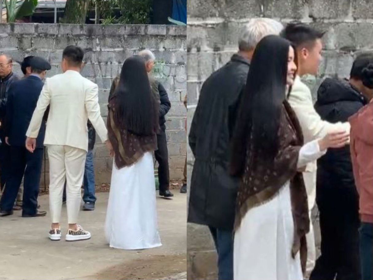 Quang Hải và bạn gái diện trang phục với tông màu trắng trong lễ dạm ngõ. Ảnh cắt từ video