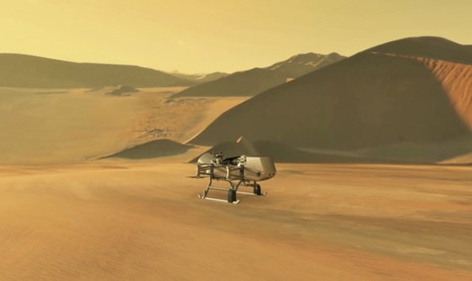 Hình minh họa của NASA cho thấy tàu đổ bộ cánh quạt Dragonfly đang tiếp cận mặt trăng Titan của Sao Thổ. Ảnh: NASA