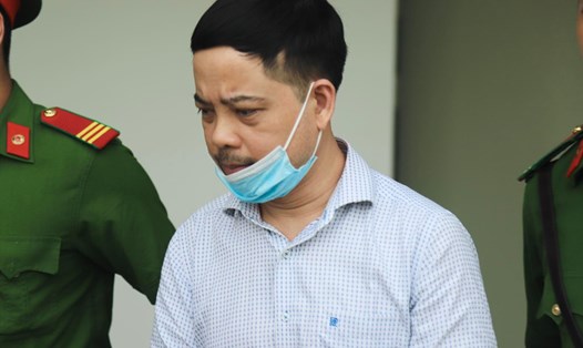 Bị cáo Phạm Trung Kiên - cựu Thư ký Thứ trưởng Bộ Y tế bị dẫn giải chiều 13.7. Ảnh: Quang Việt