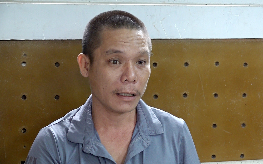 Nguyễn Tuyết Cường thời điểm bị bắt sau khi chém chết người. Ảnh: Vũ Tiến