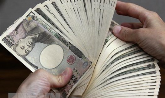 Đồng yên Nhật rung lắc mạnh vì tin tức Nhật Bản điều chỉnh chính sách tiền tệ. Ảnh: TTXVN 