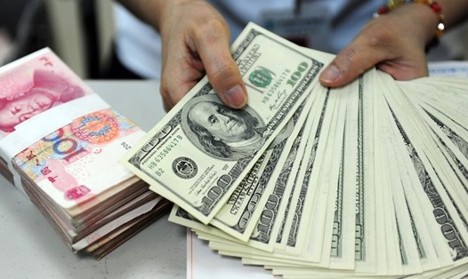 Lãi suất tiền gửi USD ở một số ngân hàng lớn tại Trung Quốc giảm mạnh. Ảnh: Xinhua