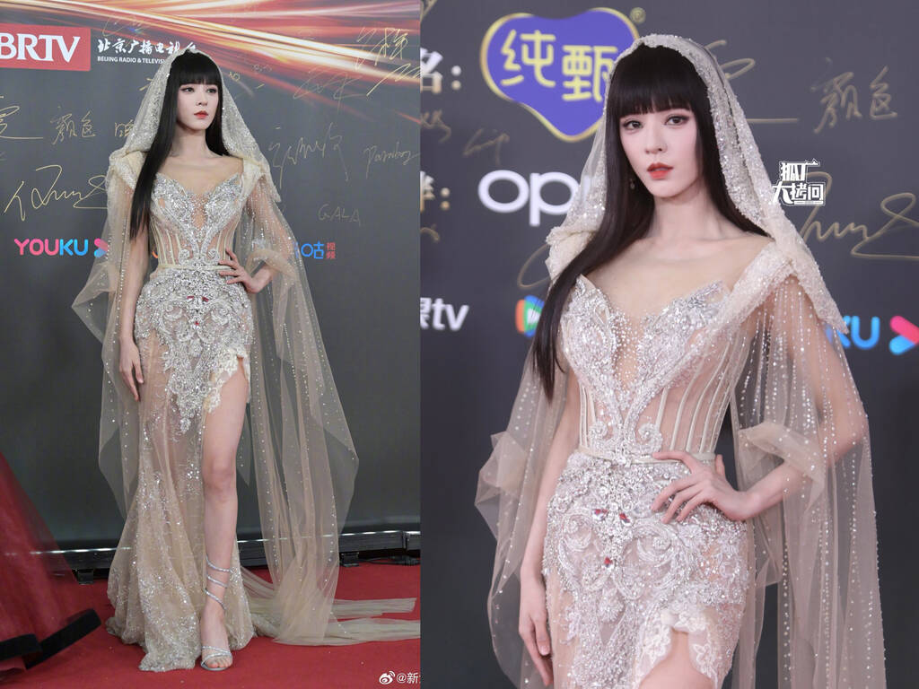 Trương Dư Hi hoá cô dâu huyền bí trong thiết kế xuyên thấu từ thương hiệu váy cưới cao cấp JoliPoli Couture của nữ nhà thiết kế Việt, Phạm Đăng Anh Thư. Ảnh: Weibo