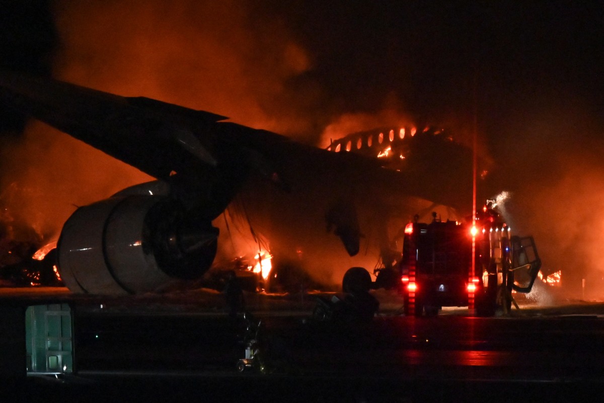 Vụ cháy máy bay xảy ra trong bối cảnh Nhật Bản đối mặt với trận động đất lớn ngày 1.1.2024. Ảnh: AFP