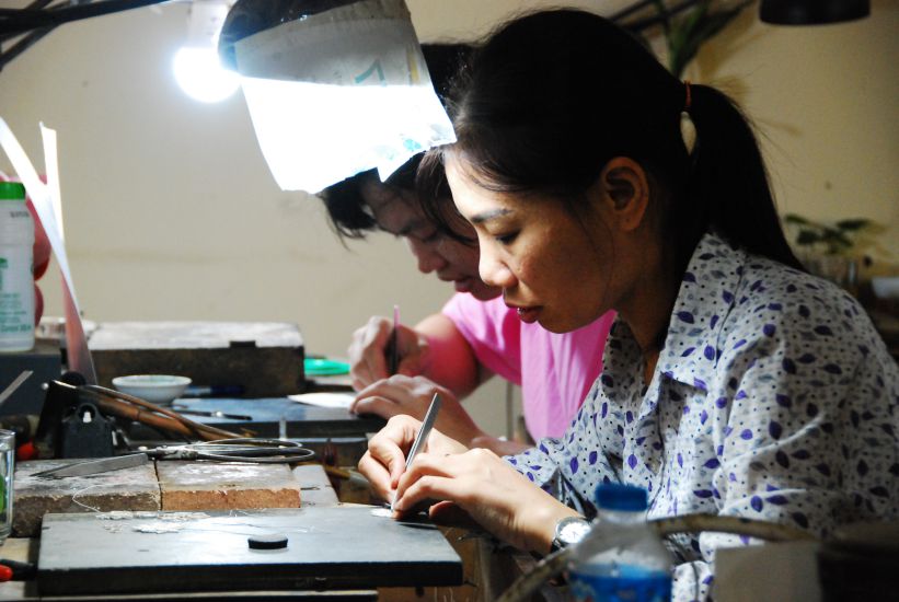 Artisans of Dinh Cong goldsmith village meticulously craft each silver thread. Photo: Huyen Chi