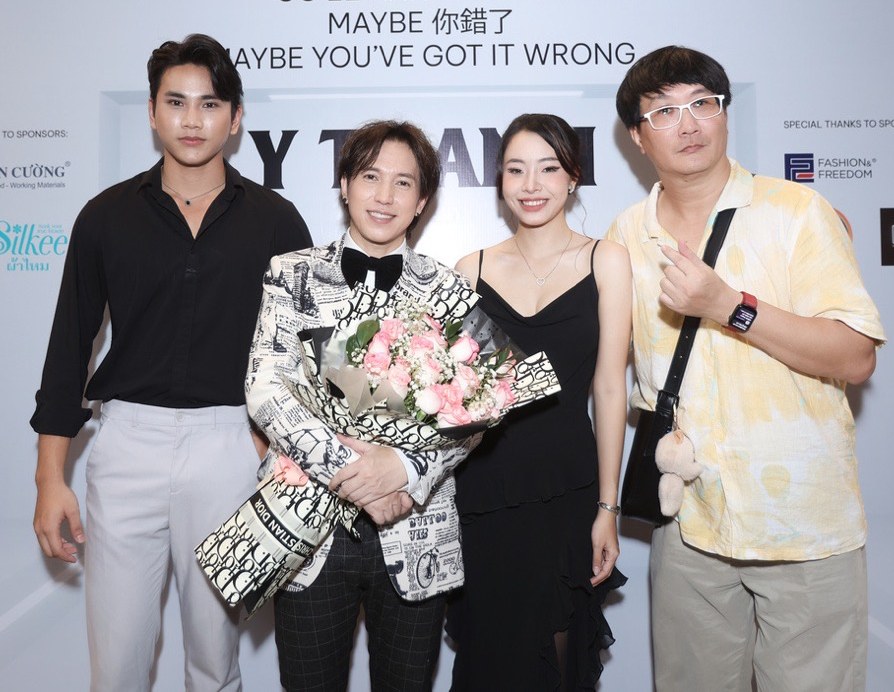 Singer Y Thanh (in suit) and colleagues. Photo: Artist.