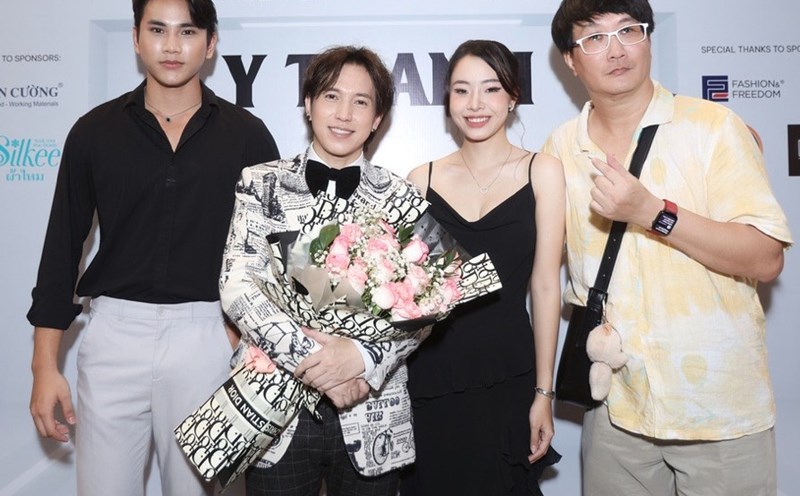 Singer Y Thanh (in suit) and colleagues. Photo: Artist.
