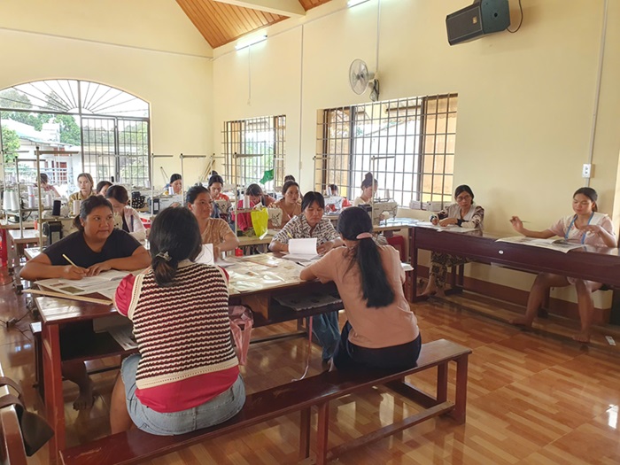 Workers practice cutting and finishing garment products. Photo: Pham Quang