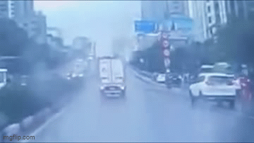 Car nearly flipped over to avoid pedestrians crossing the street in Hanoi.