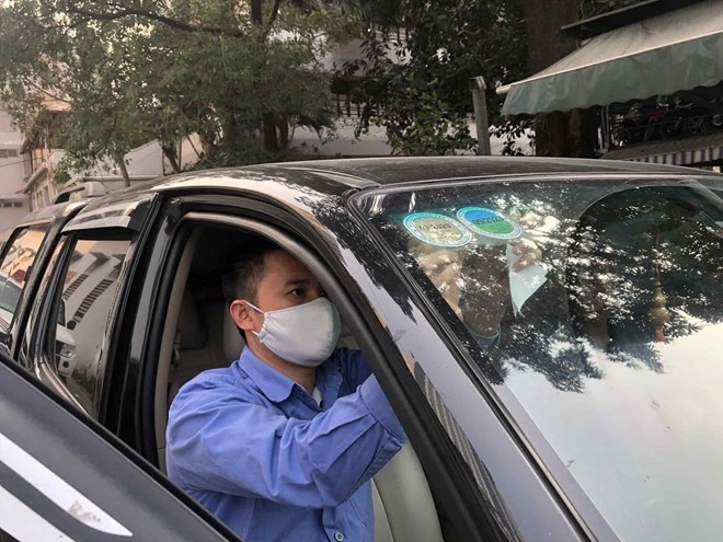 Normally, people will pay road fees when going for vehicle inspection. Photo: Huu Chanh