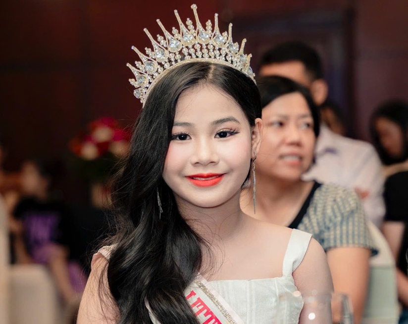 Child model competing in international competition. Photo: Organizing Committee