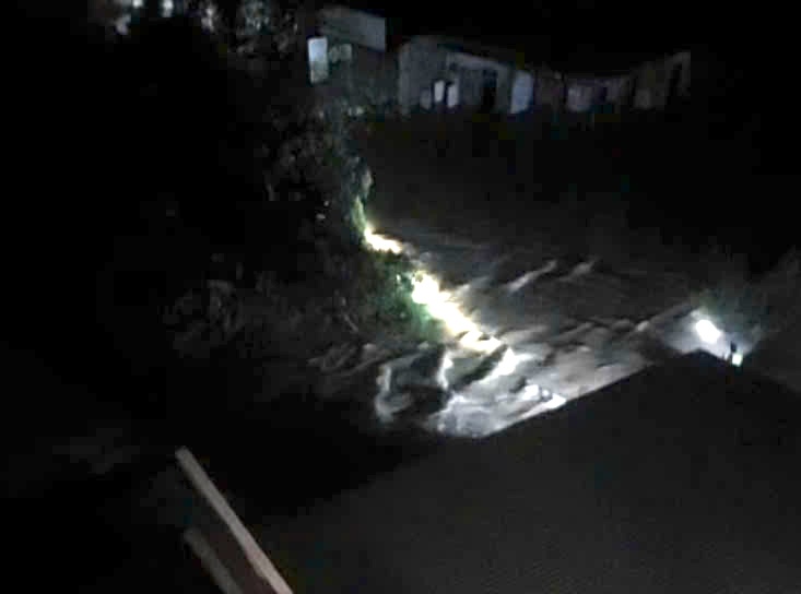 The location where two people were swept away by floodwaters and were fortunately rescued. Photo cut from clip