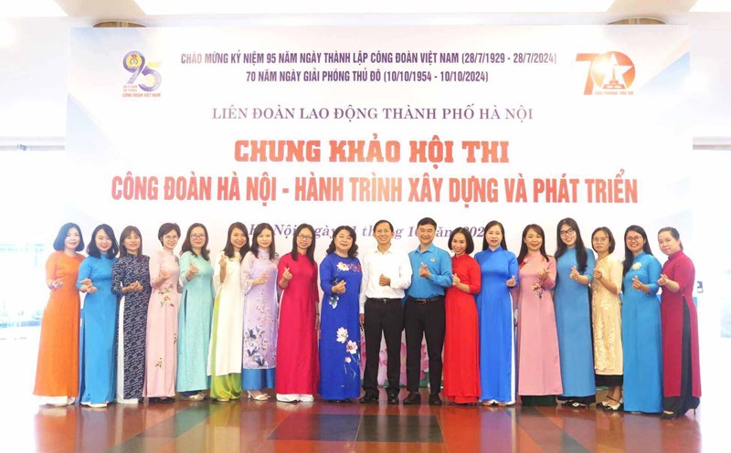 Female union members and workers wear Ao Dai at events. Photo: Union