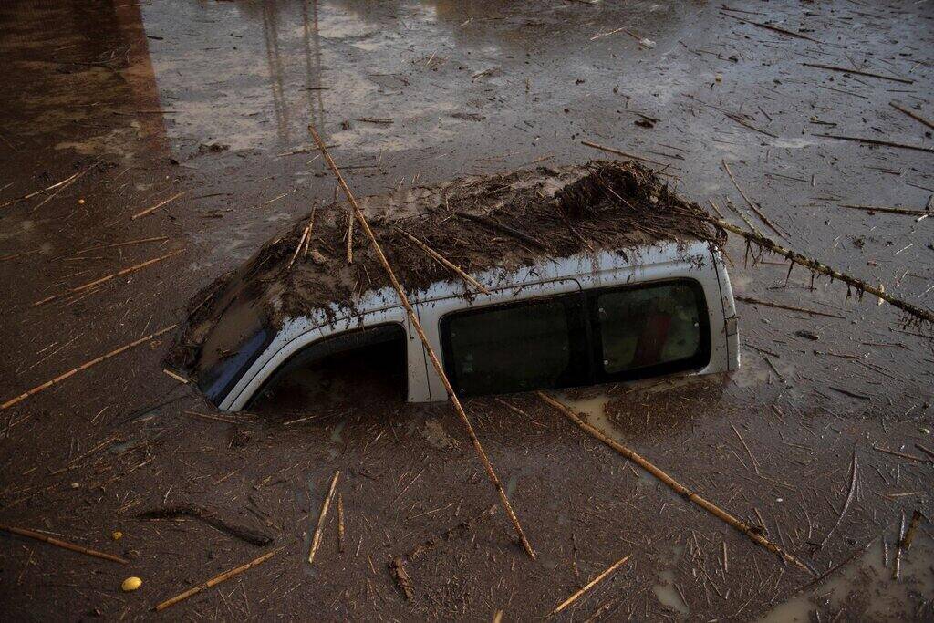Cars submerged in mud in Alora, Spain. Photo: AFP