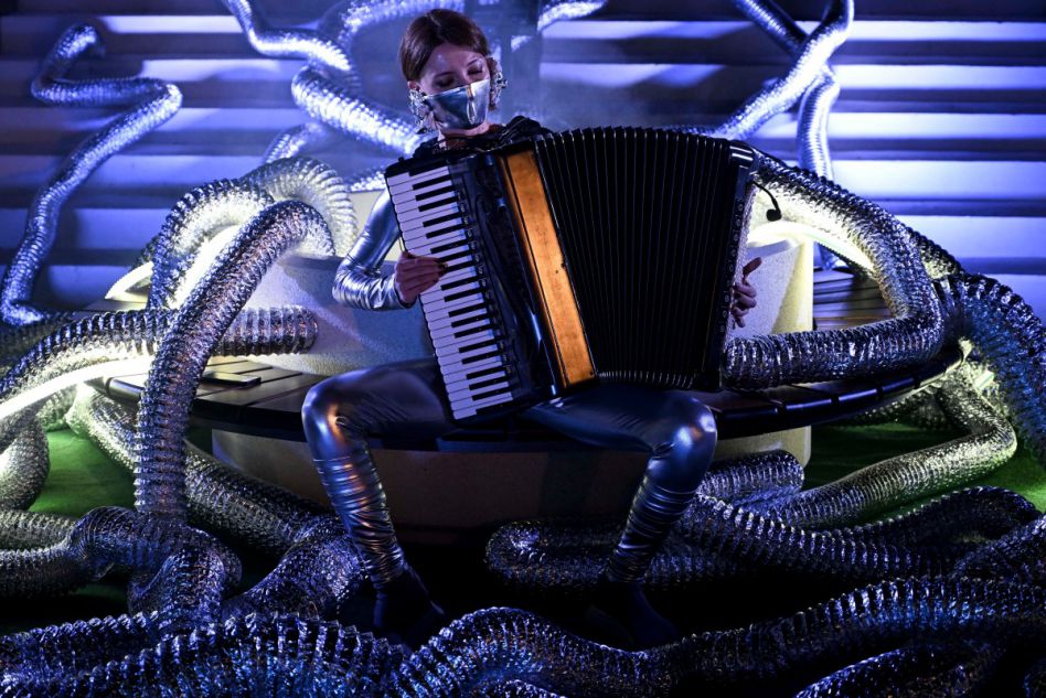 An Italian (European) artist performs with an accordion. Photo: AFP