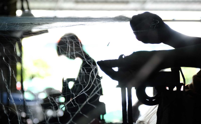 During the flood season, workers in Thom Rom net weaving village have extra income thanks to the high volume of work.