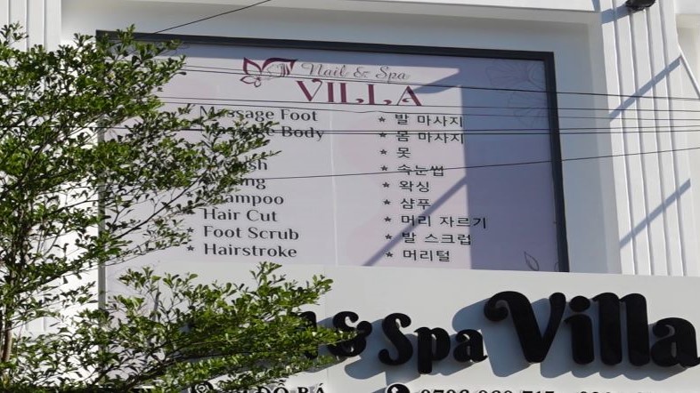 Many advertising signs in Da Nang are in foreign languages. Photo: Tran Thi