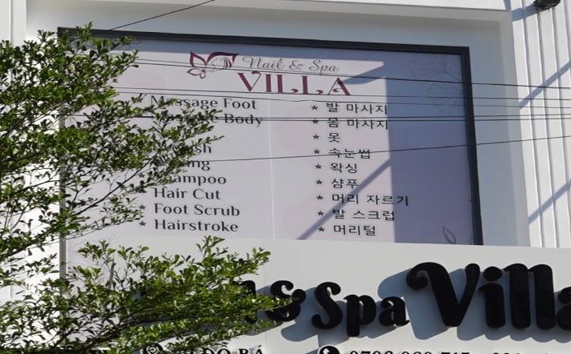 Many advertising signs in Da Nang are in foreign languages. Photo: Tran Thi