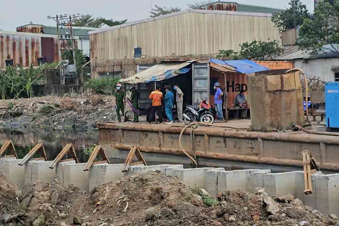 The scene of a man's body floating in a canal in Ho Chi Minh City.