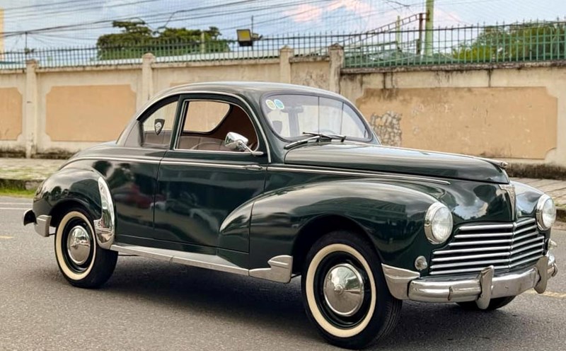 The 1954 Peugeot 203 Coupe A Vendre has a rare time on the street. Photo: Nguyen Tien