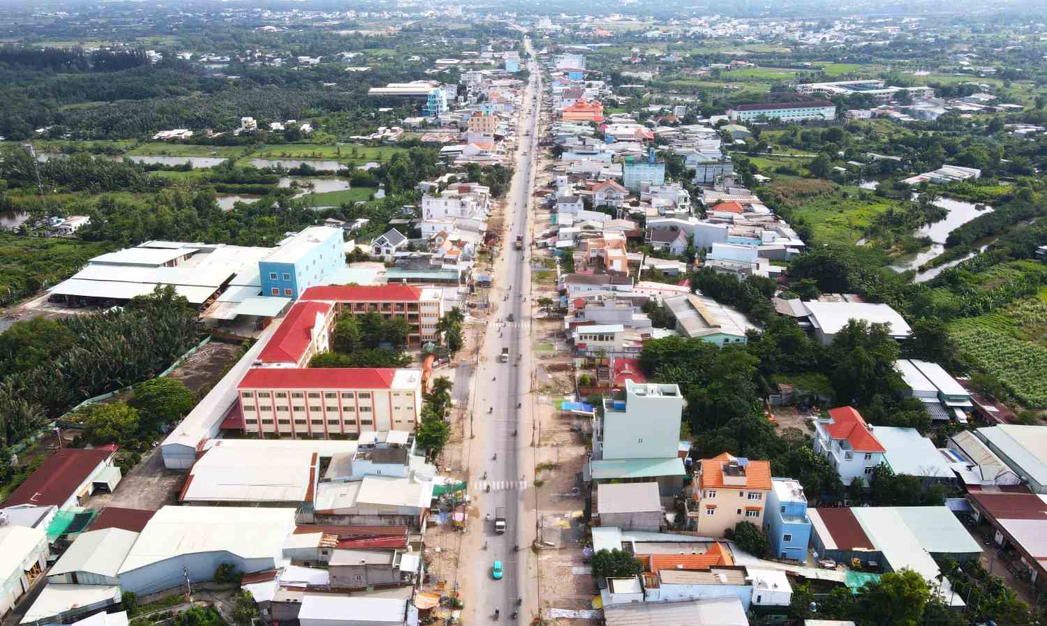 Existing National Highway 50 through Binh Chanh District (HCMC) is being expanded. Photo: Minh Quan