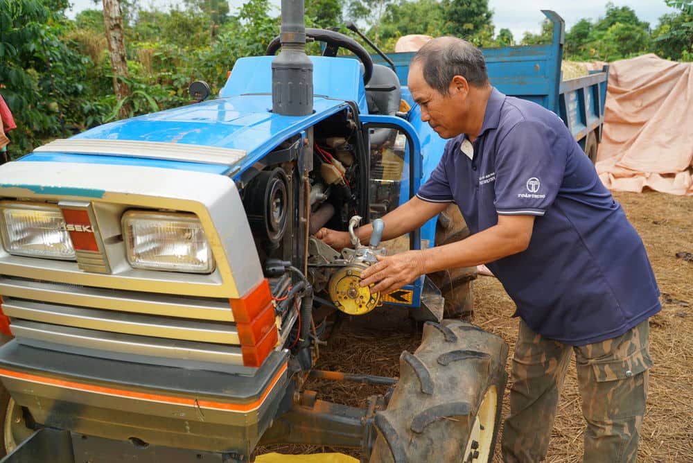Mr. Ksor In was taught how to repair small capacity machines to serve the coffee harvest season. Photo: Tra My