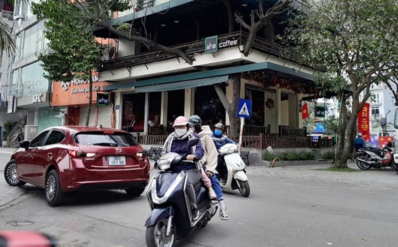 Motorbikes are only allowed to carry 3 people in certain cases specified by law. Photo: Xuyen Dong