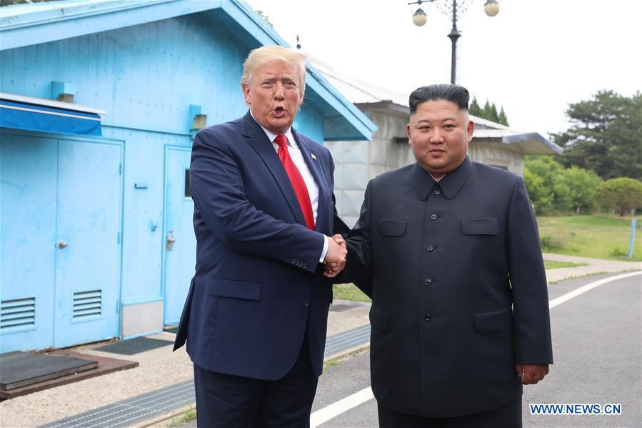 President Donald Trump and North Korean leader Kim Jong-un at the border village of Panmunjom on June 30, 2019. Photo: Xinhua
