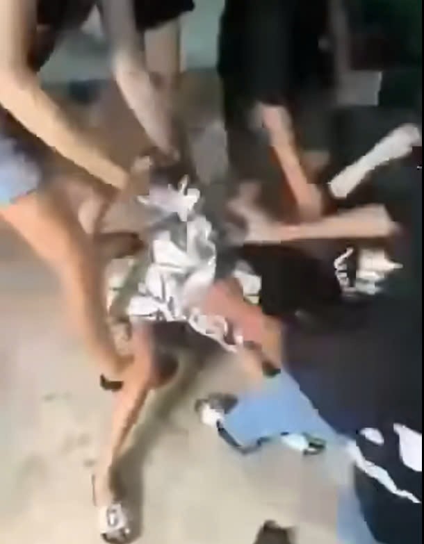 Image of a middle school girl being beaten by a group of people. Photo: clip cut