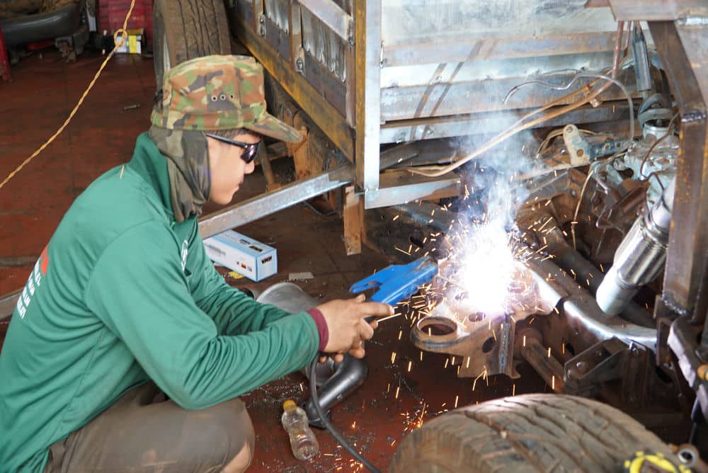 After learning the trade, Min opened a shop to repair agricultural vehicles and small tractors in Glar commune. Photo: Huyen Trang