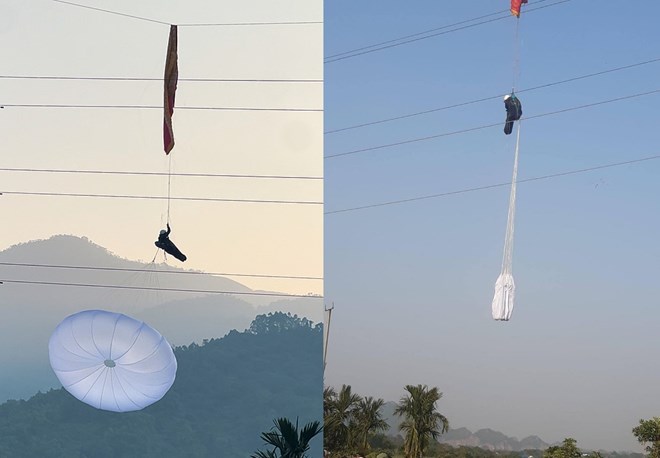 A parachutist got stuck on a 110kV high voltage power line. Photo: Anh Duc