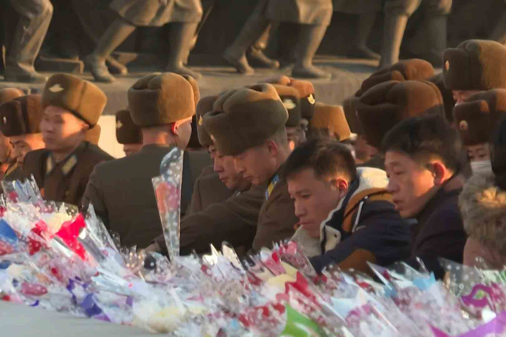 North Korean people lay flowers in memory of Kim Jong-il