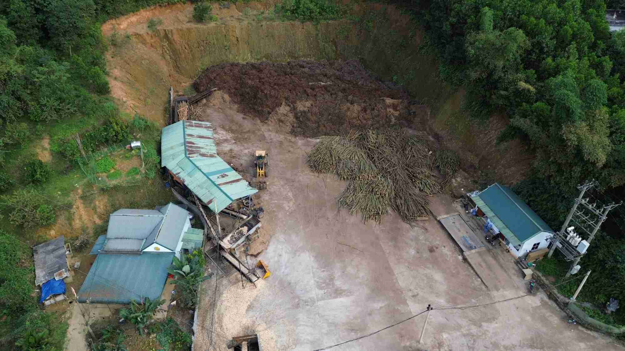 Panoramic view of a wood workshop blatantly leveling a hill, part of forestry land in Hoa Binh. Photo: Khanh Linh