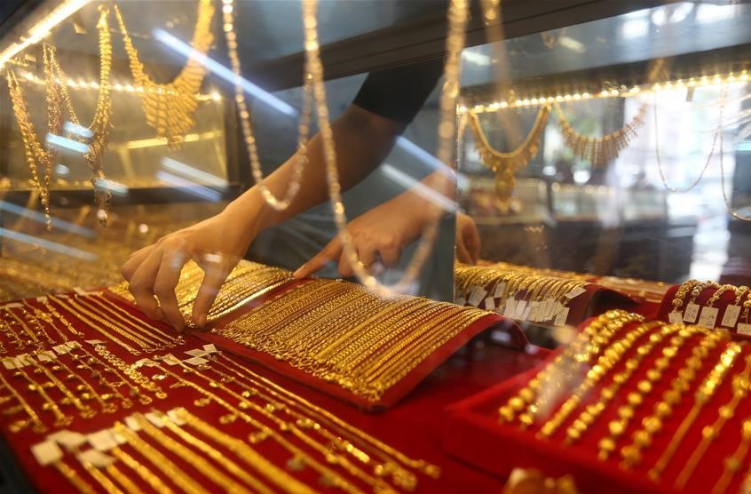 Gold prices fell after the Fed's move. Photo: Xinhua