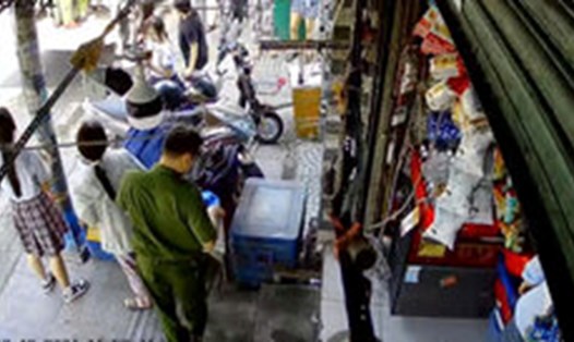 Công an quận Tân Phú đến tiệm tạp hóa của chị C để điều tra vụ việc chị bị hành hung. Ảnh: Ngọc Duy