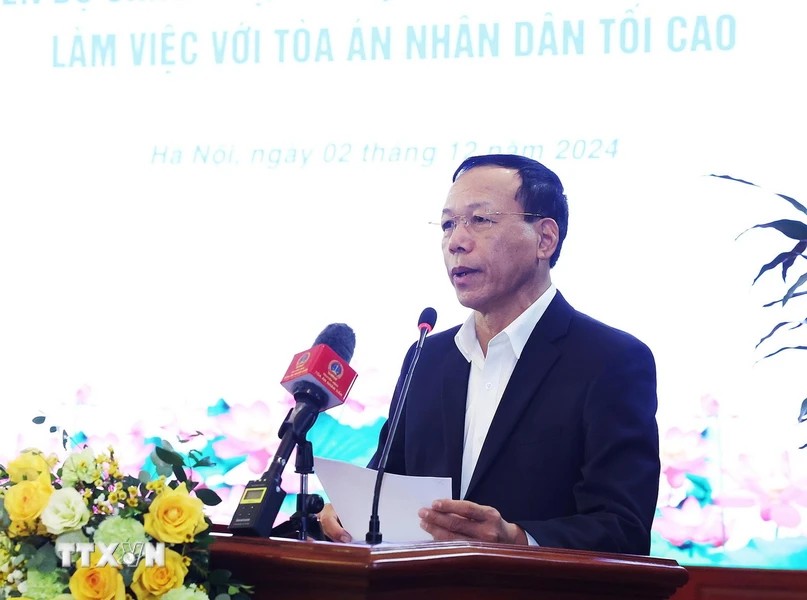 Pho Chanh an Thuong truc Toa an Nhan dan Toi cao Nguyen Tri Tue trinh bay bao cao. Anh: TTXVN