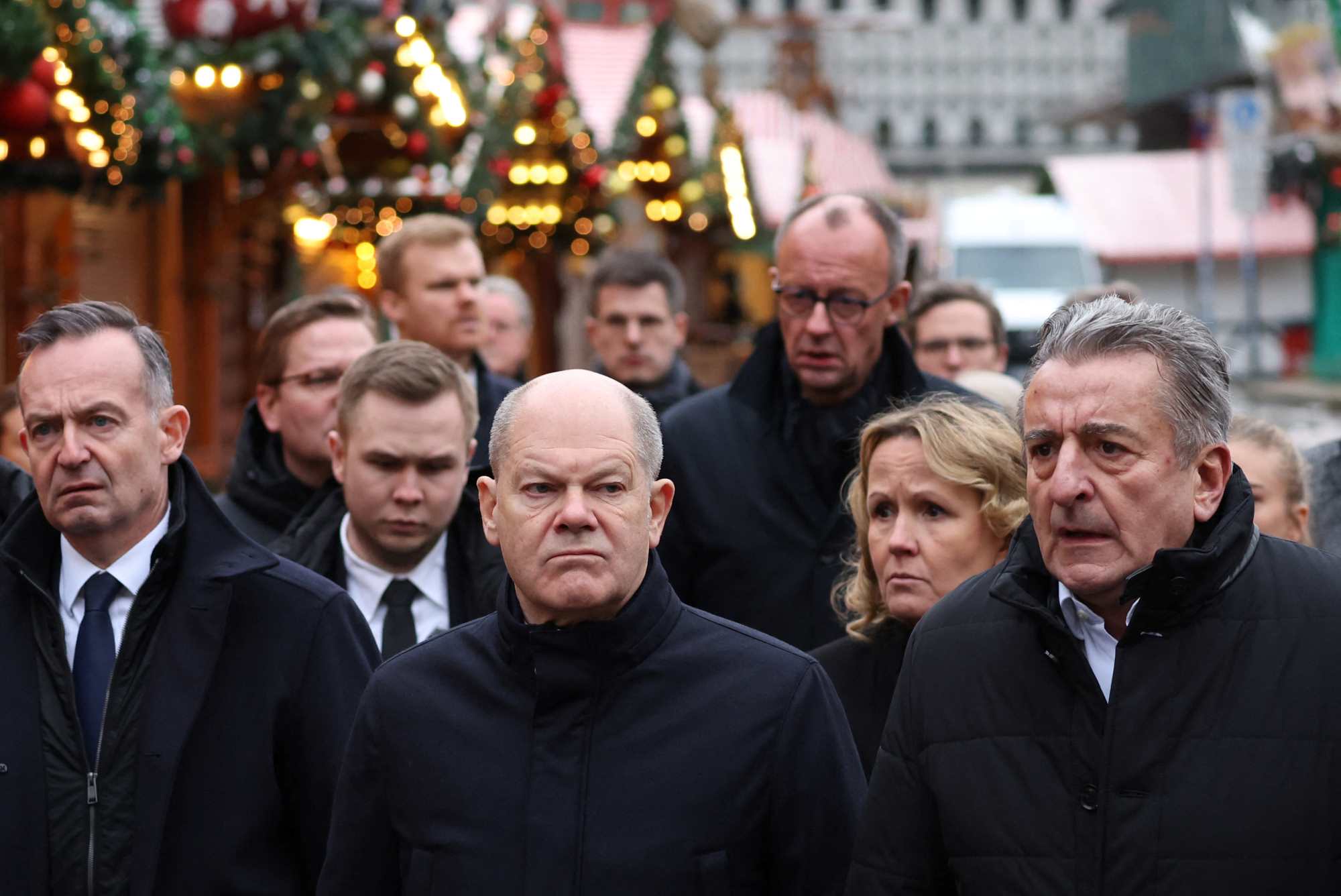 German Chancellor Olaf Scholz (center, front row) visits the scene of the Christmas market attack in Magdeburg on December 21. Photo: AFP