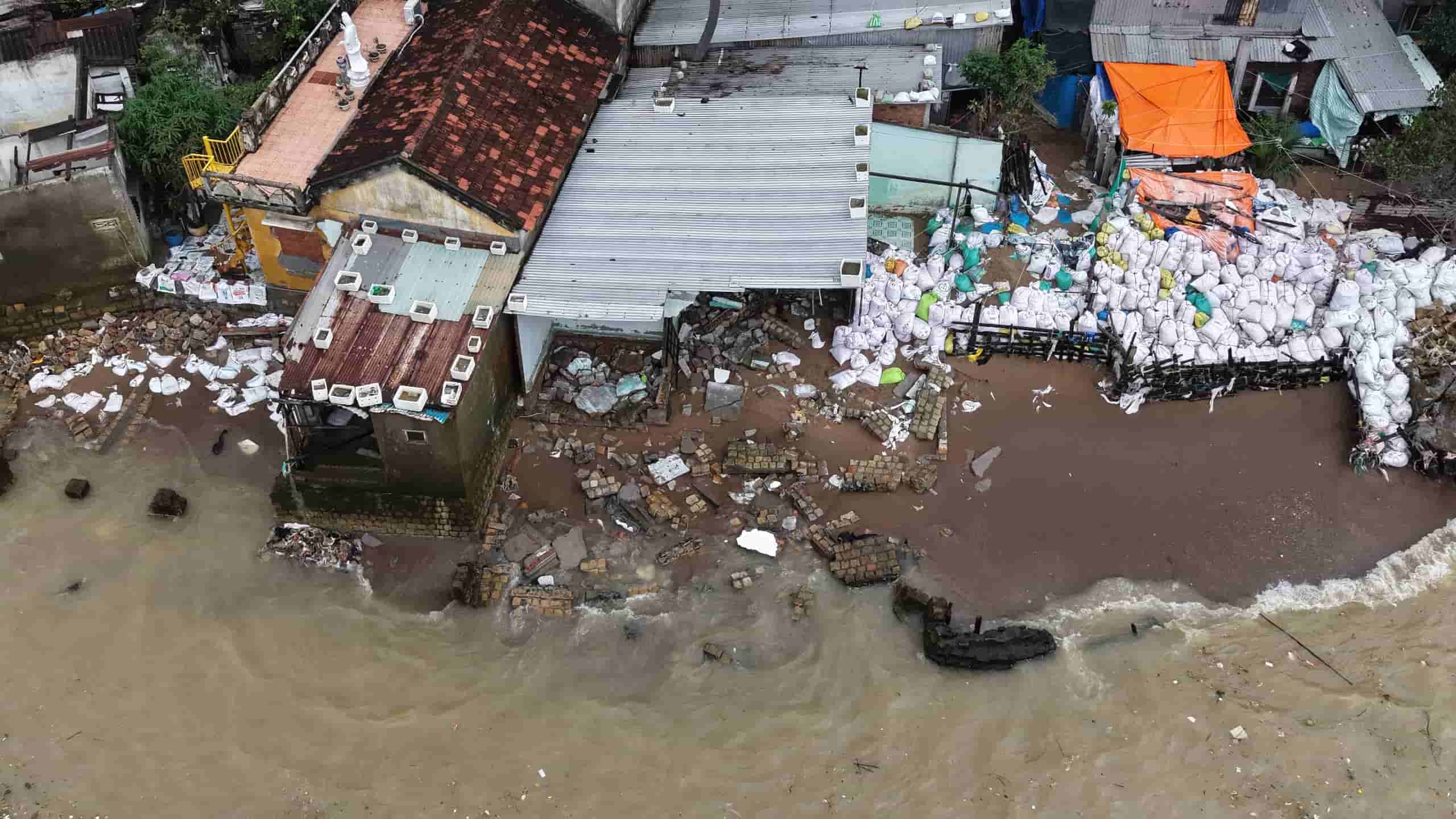 Residents of Nhat Tri islet in Nha Trang are worried because big waves have destroyed their houses.