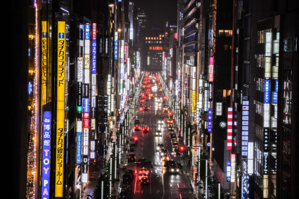 A street lit by billboards in Tokyo, Japan. Photo: AFP