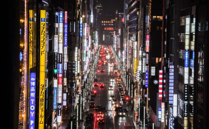 A street lit by billboards in Tokyo, Japan. Photo: AFP