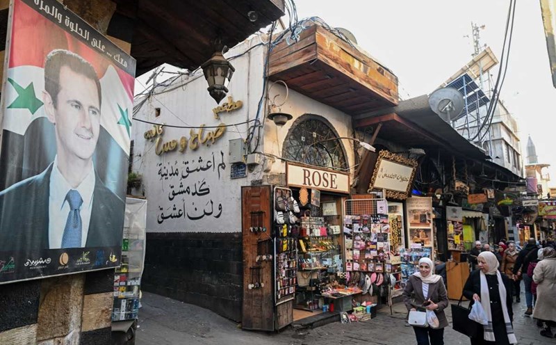 Portrait of Syrian President Bashar al-Assad in the old quarter of the capital Damascus on January 6, 2024. Photo: AFP