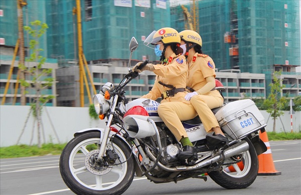 Traffic police use cars and motorbikes for patrolling. Photo: Chan Phuc