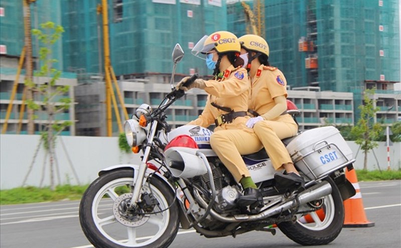 Traffic police use cars and motorbikes for patrolling. Photo: Chan Phuc