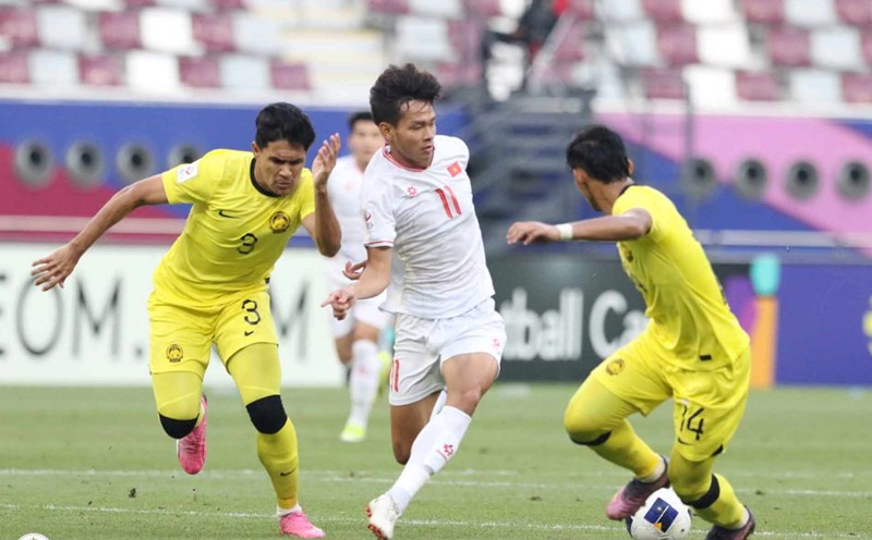 U23 Việt Nam trong trận đấu với U23 Malaysia. Ảnh: VFF