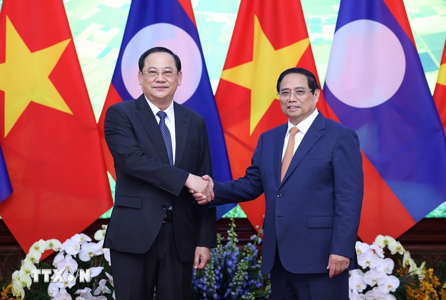 Thủ tướng Sonexay Siphandone cảm ơn Thủ tướng Chính phủ Phạm Minh Chính đã mời tham dự Diễn đàn Tương lai ASEAN. Ảnh: Dương Giang/TTXVN