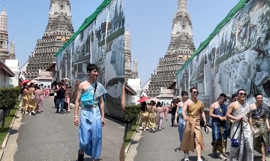 Việc du khách nam mặc trang phục nữ khi đi chùa nhận được nhiều phản ứng tích cực. Ảnh: TikTok Krumaywa