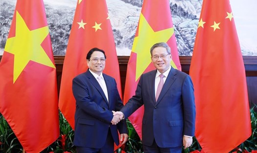 Ủy viên Bộ Chính trị, Thủ tướng Chính phủ Phạm Minh Chính và Thủ tướng Trung Quốc Lý Cường. Ảnh: TTXVN