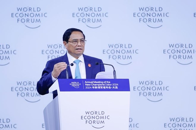 Thủ tướng Chính phủ Phạm Minh Chính phát biểu tại phiên khai mạc toàn thể Hội nghị WEF Đại Liên 2024, ngày 25.6. Ảnh: VGP