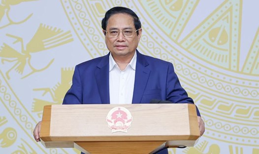 Thủ tướng Chính phủ Phạm Minh Chính yêu cầu chỉ bàn làm, không bàn lùi để thúc đẩy mạnh mẽ động lực chuyển đổi số. Ảnh: VGP