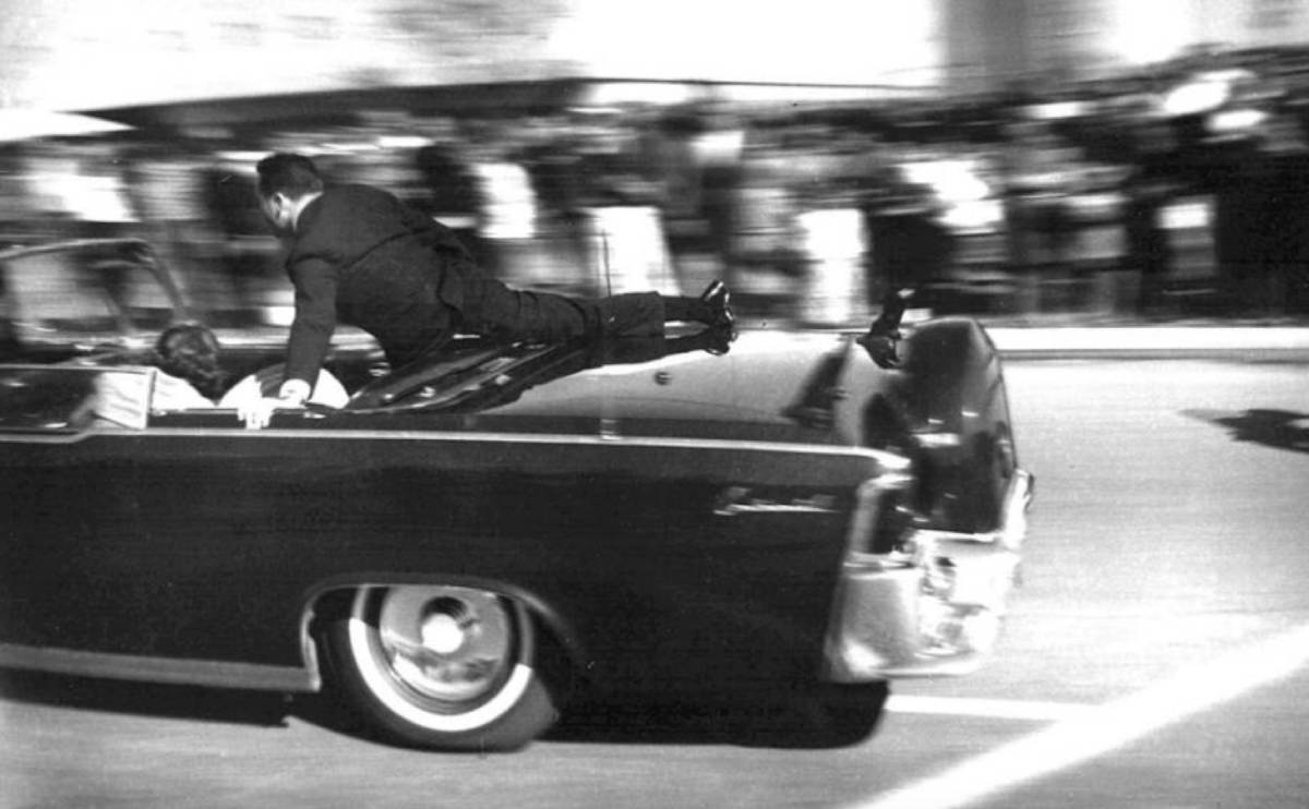 US Secret Service Agent Clint Hill rushed to the back of the President's car, seconds after the shots rang out. Photo: Public Domain